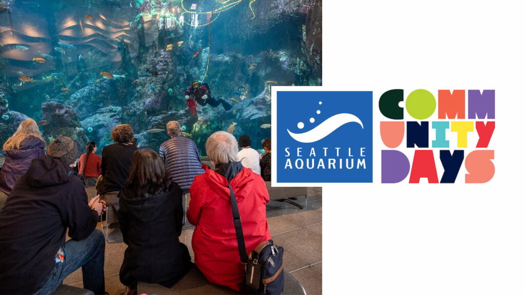 A group of people watching a dive presentation in the Window on Washington Waters habitat. The Community Days logo is on the right.