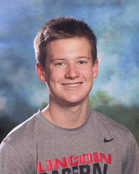 Lucas smiling for a portrait photo.