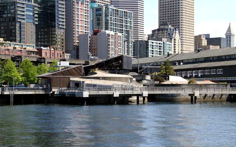A photo of the back of the Seattle Aquarium campus, taken from the water.