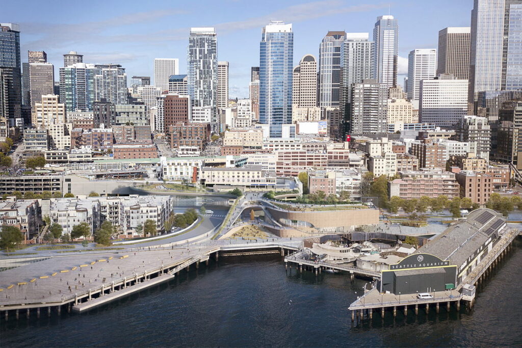 Concept rendering of the Seattle Aquarium campus, featuring the new Ocean Pavilion building, as it fits into the downtown Seattle city skyline.