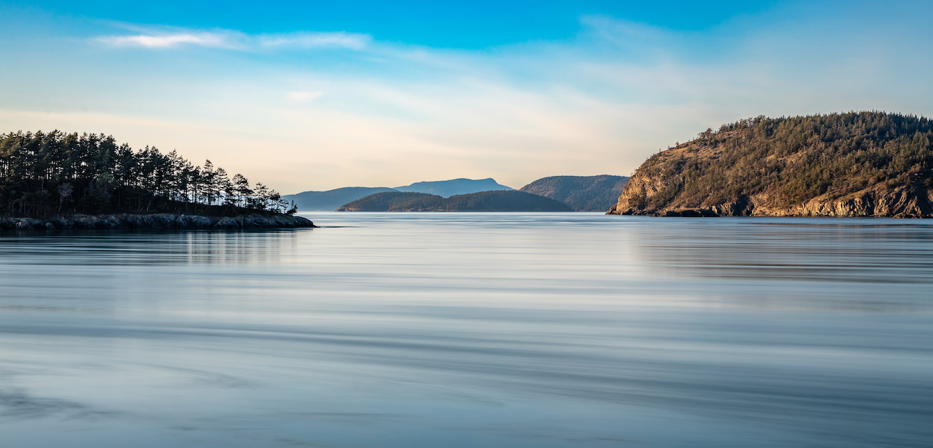 A stretch of the Salish Sea dotted by small landmasses.