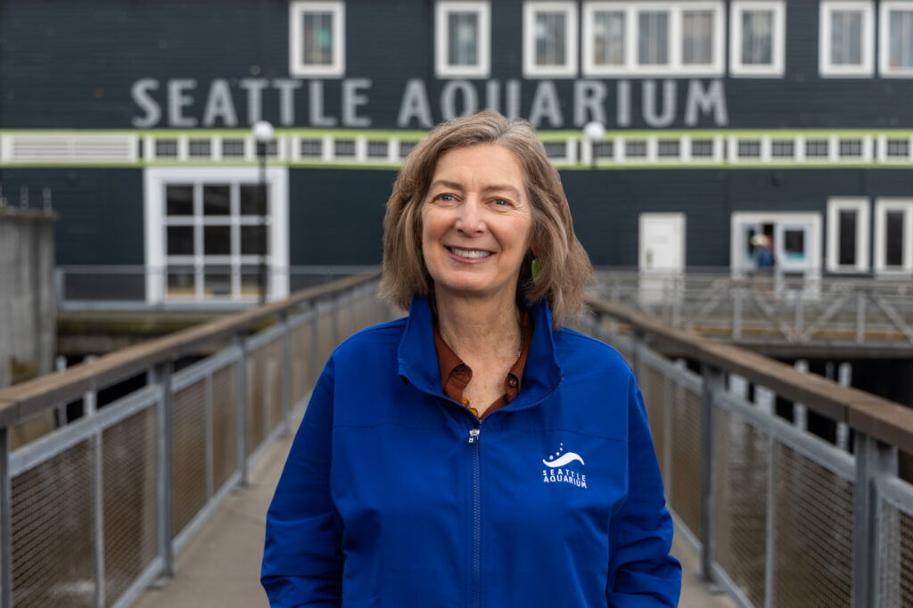 Peggy standing in front of the Seattle Aquarium.
