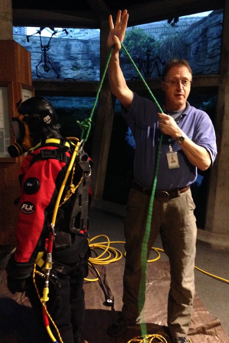Jeff helping a Seattle Aquarium diver get ready for a dive.