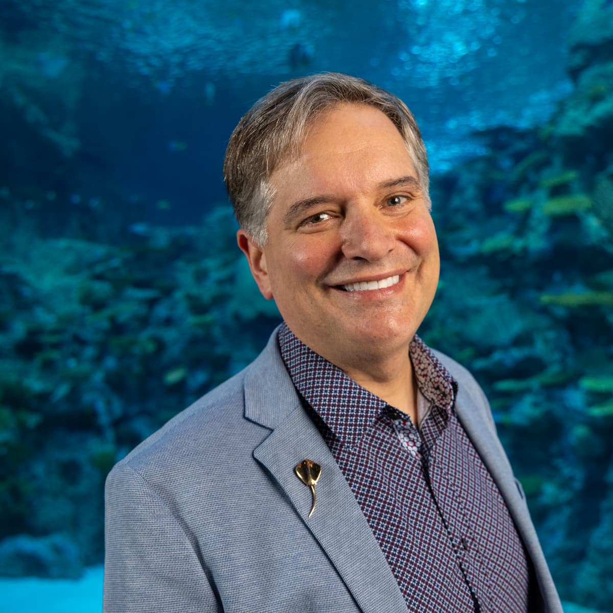 Jamil Rich standing in front of the Window on Washington Waters.