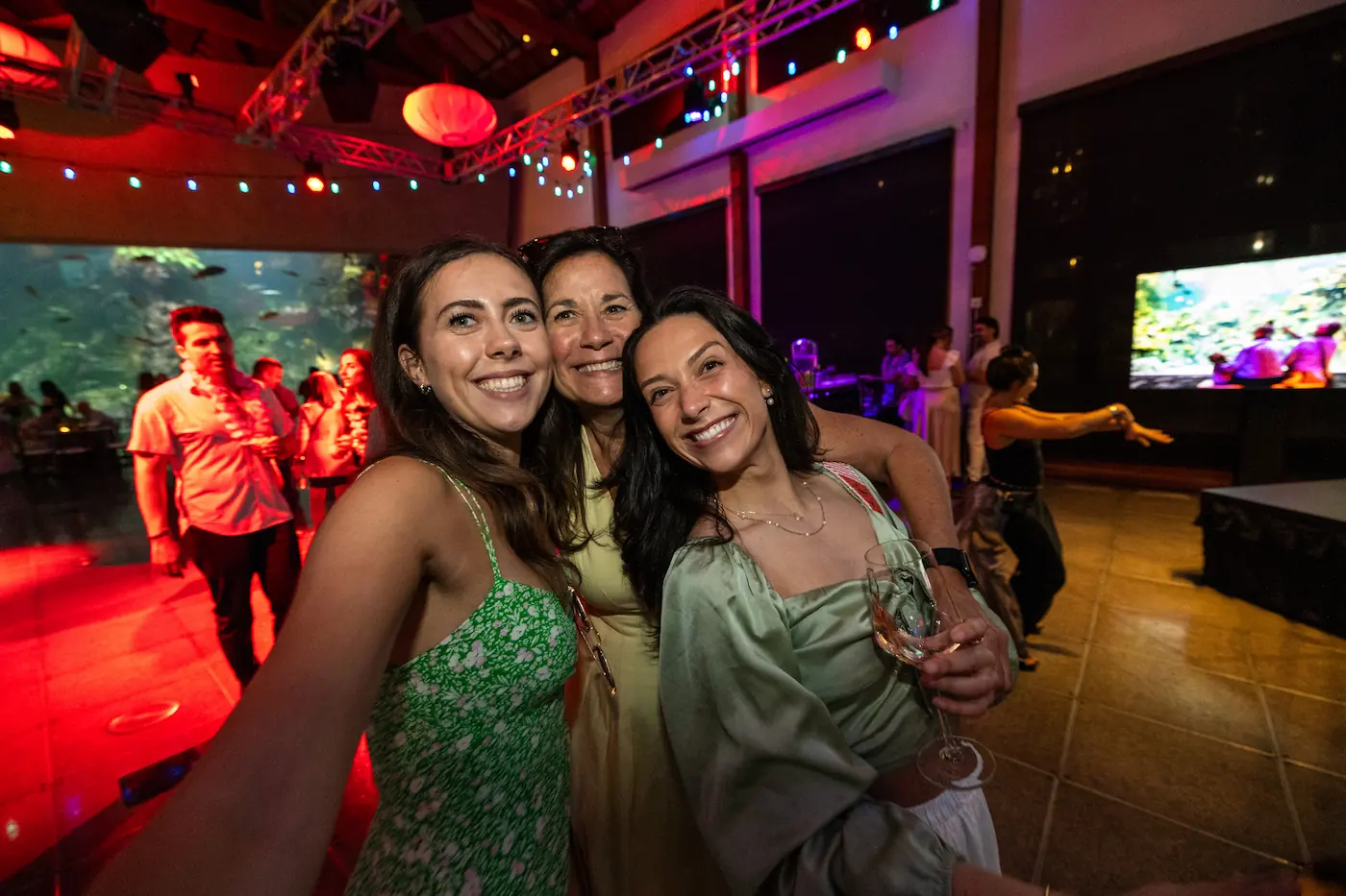 Three women pose for a photo during the Seattle Aquarium's Splash annual fundraising event.