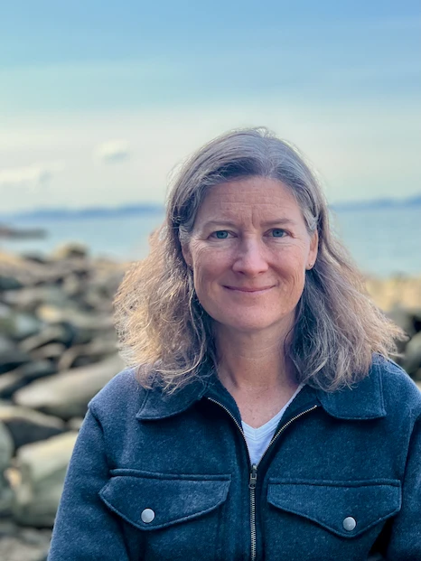 Dr. Kathryn L. Sobocinski smiling for a photo on a beach during a sunny day.